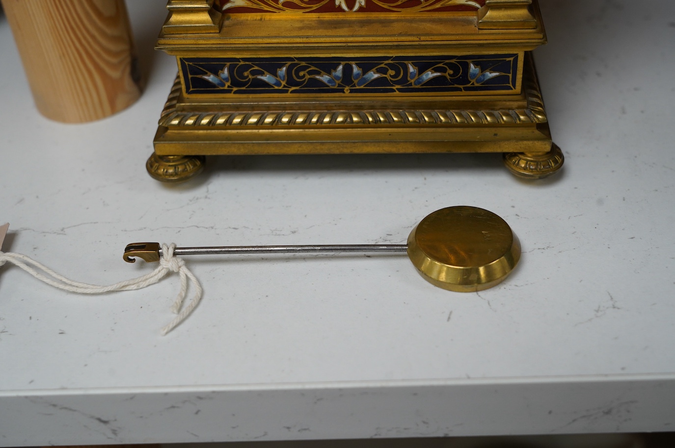 A late 19th century French champlevé enamel mantel clock, 22cm. Condition - good but with wear to dial, not tested as working